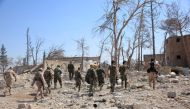 Forces loyal to Syria's President Bashar al-Assad walk at a military complex, after they recaptured areas in southwestern Aleppo that rebels had seized last month, Syria, in this handout picture provided by SANA on September 5, 2016. SANA
