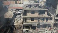 Syrians search for victims at the scene of a reported air strike on the rebel-held northwestern city of Idlib on September 10, 2016. More than 290,000 people have been killed in Syria since its conflict erupted in March 2011, and millions displaced by the