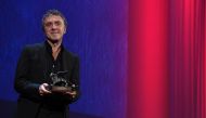 Director Reha Erdem holds the Special Orizzonti Jury Prize for his movie 