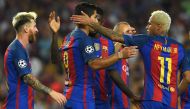 Barcelona's Uruguayan forward Luis Suarez (C) is congratulated by Barcelona's Brazilian forward Neymar (R) and Barcelona's Argentinian forward Lionel Messi (L) after scoring a goal during the UEFA Champions League football match FC Barcelona vs Celtic FC 