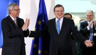 Outgoing president of the European Commission Jose Manuel Barroso reacts as he is applauded by incoming president of the EU Commission Jean-Claude Juncker (L) during a ceremony at the EU Commission headquarters in Brussels October 30, 2014. REUTERS/Franco