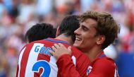 Atletico Madrid's Antoine Griezmann (R) celebrates his goal with teammate Diego Godin. REUTERS/Andrea Comas