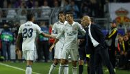 Cristiano Ronaldo(C) and Head coach Zinedine Zidane(R) of Real Madrid CF celebrate after scoring a goal during the UEFA Champions League group F soccer match between Borussia Dortmund and Real Madrid CF at the Signal Iduna Park stadium in Dortmund, German