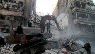 Search and rescue team members carry out search and rescue operation on the rubble of a building after the war crafts belonging to the Russian Army bombed in the al-Shear district of Aleppo, Syria on September 28, 2016. (Jawad al Rifai - Anadolu Agency)