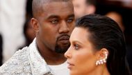 Musician Kanye West (L) and wife Kim Kardashian arrive at the Met Gala to celebrate the opening of 