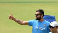Indian Test captain Virat Kohli gestures during a training session at The Holkar Cricket Stadium in Indore on October 7, 2016. India plays the third Test match against New Zealand from October 8 in Indore. (AFP / PUNIT PARANJPE)