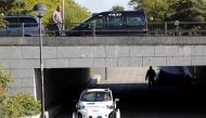 A taxi driver watches as a driverless pod is tested in Milton Keynes, Britain, October 11, 2016. REUTERS/Darren Staples
