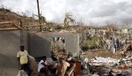 A couple sitting on the rubble that was once their home. Reuters 