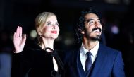 Australian actress Nicole Kidman (L) and British actor Dev Patel pose on the red carpet after arriving to attend a gala screening of the film 