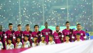 Qatari players sing their national anthem before the Asian Football Confederation Under-19 Championship semi-final match against Myanmar at the Thuwunna Youth Training Centre Stadium in Yangon in this October 2014 file photo. 