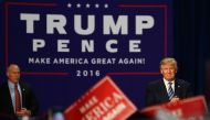 Republican Presidential Nominee Donald Trump (R) addresses the crowd at his rally at the Convention Center in Charlotte, North Carolina on October 14, 2016. AFP / Logan Cyrus
