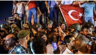 Turkish soldiers stay with weapons at Taksim square as people protest against the military coup in Istanbul on July 16. Photo: OZAN KOSE / AFP / TT