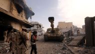 Members of the forces loyal to Libya's UN-backed Government of National Accord (GNA) gather in the coastal city of Sirte, east of the capital Tripoli, during their military operation to clear the Islamic State group's (IS) jihadists from the city, on Octo