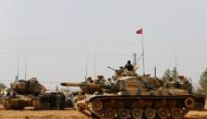 Turkish army tanks and military personal are stationed in Karkamis on the Turkish-Syrian border in the southeastern Gaziantep province, Turkey, August 25, 2016. REUTERS/Umit Bektas/File Photo