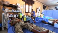 Members of the forces loyal to Libya's UN-backed Government of National Accord (GNA) are seen in a field hospital in the coastal city of Sirte, east of the capital Tripoli, during their military operation to clear the Islamic State group's (IS) jihadists 