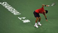 This file photo taken on October 15, 2016 shows Novak Djokovic of Serbia smashing his racket after losing a point against Roberto Bautista Agut of Spain in their men's singles semi-finals match at the Shanghai Masters tennis tournament in Shanghai. AFP / 