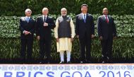 (L-R) Brazilian President Michel Temer, Russian President Vladimir Putin, Indian Prime Minister Narendra Modi, Chinese President Xi Jinping and South African President Jacob Zuma pose for a group photo during the BRICS Summit in Goa on October 16, 2016. A