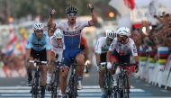 Slovakia's Peter Sagan celebrates after winning the men's elite road race event as part of the 2016 UCI Road World Championships on October 16, 2016, in the Qatari capital Doha. / AFP / KARIM JAAFAR
