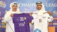 El Jaish and Al Ain club officials display  the team jerseys during the press conference yesterday.  