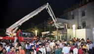 Indian rescue workers trying help victims of a massive fire at the SUM hospital building in Bhubaneswar, the capital of coastal Odisha state. AFP