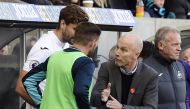 Swansea City's Fernando Llorente speaks to Swansea City manager Bob Bradley before coming on as a substitute. (Reuters / Rebecca Naden)