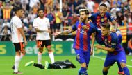 Barcelona's Argentinian forward Lionel Messi (C) celebrates with Barcelona's Brazilian forward Neymar (2ndR) and Barcelona's midfielder Denis Suarez (R) after scoring during the Spanish league football match Valencia CF vs FC Barcelona at the Mestalla sta