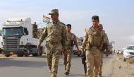 Peshmerga forces are seen on armoured vehicles as they are on their way to Kirkuk for the planned Havice Operation during an operation to retake Iraq's Mosul from Daesh terrorists, in Nineveh, Iraq on October 21, 2016.  Feriq Fereç - Anadolu Agency 