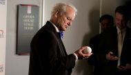 Actor, comedian and Chicago Cubs fan Bill Murray look at a baseball as he arrives to receive the 19th annual Mark Twain Prize for American Humor at the Kennedy Center in Washington, U.S., October 23, 2016. Reuters/Joshua Roberts