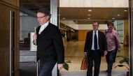 Barrister Tim Owen (L) and lawyer Michael Vidler (C), defending former British banker Rurik Jutting (not seen), 31, who is accused of the murders of two Indonesian women, leave the High Court during a break for lunch in Hong Kong on October 24, 2016, on t