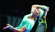 Svetlana Kuznetsova of Russia in action against Agnieszka Radwanska of  Poland during their match in the Singapore WTA  Finals Round Robin Singles, at the National Indoor Stadium, in Singapore, yesterday.