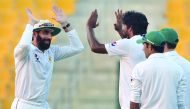 Pakistan captain Misbah-ul-Haq (left) celebrates with bowler Rahat Ali during the second Test against West Indies at the Sheikh Zayed Cricket Stadium in Abu Dhabi.