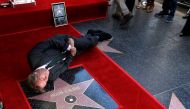 Actor Hugh Laurie poses on his star after it was unveiled on the Hollywood Walk of Fame in Los Angeles, California U.S., October 25, 2016. Reuters/Mario Anzuoni