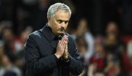 Manchester United's Portuguese manager Jose Mourinho gestures to supporters after the EFL (English Football League) Cup fourth round match between Manchester United and Manchester City at Old Trafford in Manchester, north west England on October 26, 2016.