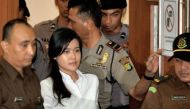 Indonesian murder suspect Jessica Kumala Wongso (C) enters the courtroom. (AFP/Bay Ismoyo)