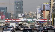 A giant poster that reads 'Strong Lebanon' and bears the portrait of Lebanese presidential candidate Michel Aoun is seen on a bridge on the Zalka highway, north of the capital Beirut on October 28, 2016.  AFP / JOSEPH EID