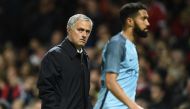 Manchester United's Portuguese manager Jose Mourinho gestures as he walks off at half time in the EFL (English Football League) Cup fourth round match between Manchester United and Manchester City at Old Trafford in Manchester, north west England on Octob