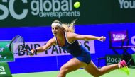 Dominika Cibulkova of Slovakia hits a return against Angelique Kerber of Germany during their women's singles final match at the WTA Finals tennis tournament in Singapore, yesterday.