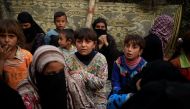 Newly displaced people are pictured at a screening center in Qayyara, south of Mosul, Iraq October 30, 2016. REUTERS/Zohra Bensemra