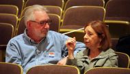 Mike Andrews(L) and Judy Osgood, both childhood friends of Democratic presidential nominee Hillary Clinton, discuss the US Presidential election and their high school classmate's front runner status, October 26, 2016 in Park Ridge, Illinois on the day tha