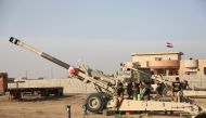 Soldiers of Iraqi Army use artillery to hit Daesh targets at the Bertilla front as the operation to retake Iraq's Mosul from Daesh terrorists continues, in Mosul, Iraq on November 1, 2016. ( Hemn Baban - Anadolu Agency )