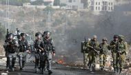 Israeli security forces take position during clashes with Palestinian protesters following a demonstration against the expropriation of Palestinian land by Israel on Nonvember 4, 2016, in the village of Kfar Qaddum, near Nablus, in the occupied West Bank.