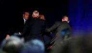 Republican presidential nominee Donald Trump is hustled off the stage by security agents during an incident at a campaign rally in Reno, Nevada, U.S. November 5, 2016. REUTERS/Carlo Allegri
