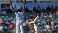 South Africa's Kagiso Rabada (L) celebrates dismissing Australia's Steve Smith (R) on day four of the first Test cricket match between Australia and South Africa in Perth on November 6, 2016. (AFP / Greg Wood)