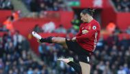 Manchester United's Swedish striker Zlatan Ibrahimovic jumps and kicks the air as he celebrates scoring his team's second goal during the English Premier League football match between Swansea City and Manchester United at The Liberty Stadium in Swansea, s