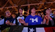 Audience members listen as musician James Taylor performs at a campaign rally with U.S. Democratic presidential nominee Hillary Clinton in Manchester, New Hampshire, U.S. November 6, 2016. REUTERS/Brian Snyder
