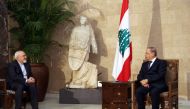 A handout picture provided by the Lebanese photo agency Dalati and Nohra on November 7, 2016, shows President Michel Aoun meeting Iranian Foreign Minister Mohammad Javad Zarif (L) at the Presidential palace in Baabda