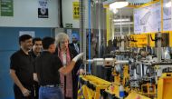 Britain's Prime Minister Theresa May speaks with the employees during her visit to a Dynamatic Technologies Limited facility in Bengaluru, India November 8, 2016. REUTERS/Abhishek N. Chinnappa