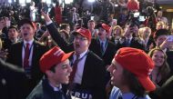 Supporters of Republican presidential nominee Donald Trump react to early poll results during election night at the New York Hilton Midtown in New York on November 8, 2016. / AFP / Mandel NGAN