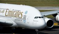 Emirates Airline net profit surges 65% in its first half on lower fuel costs and higher passenger numbers (AFP Photo/Patrik Stollarz)