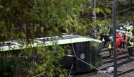 Members of the emergency services work next to a tram after it overturned injuring and trapping some passengers in Croydon, south London, Britain November 9, 2016. REUTERS/Neil Hall 
